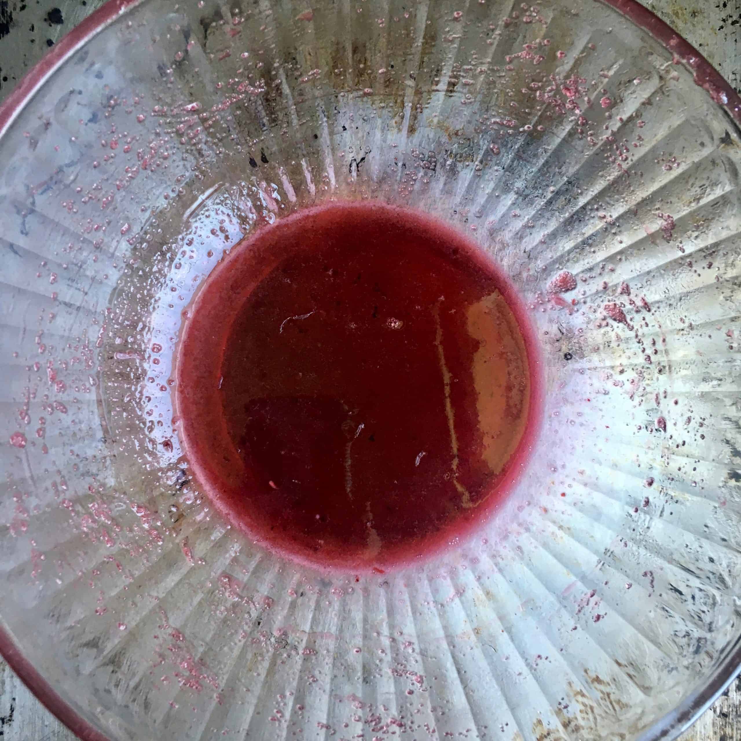 dark berry colored cornstarch slurry free of any lumps after being mixed properly