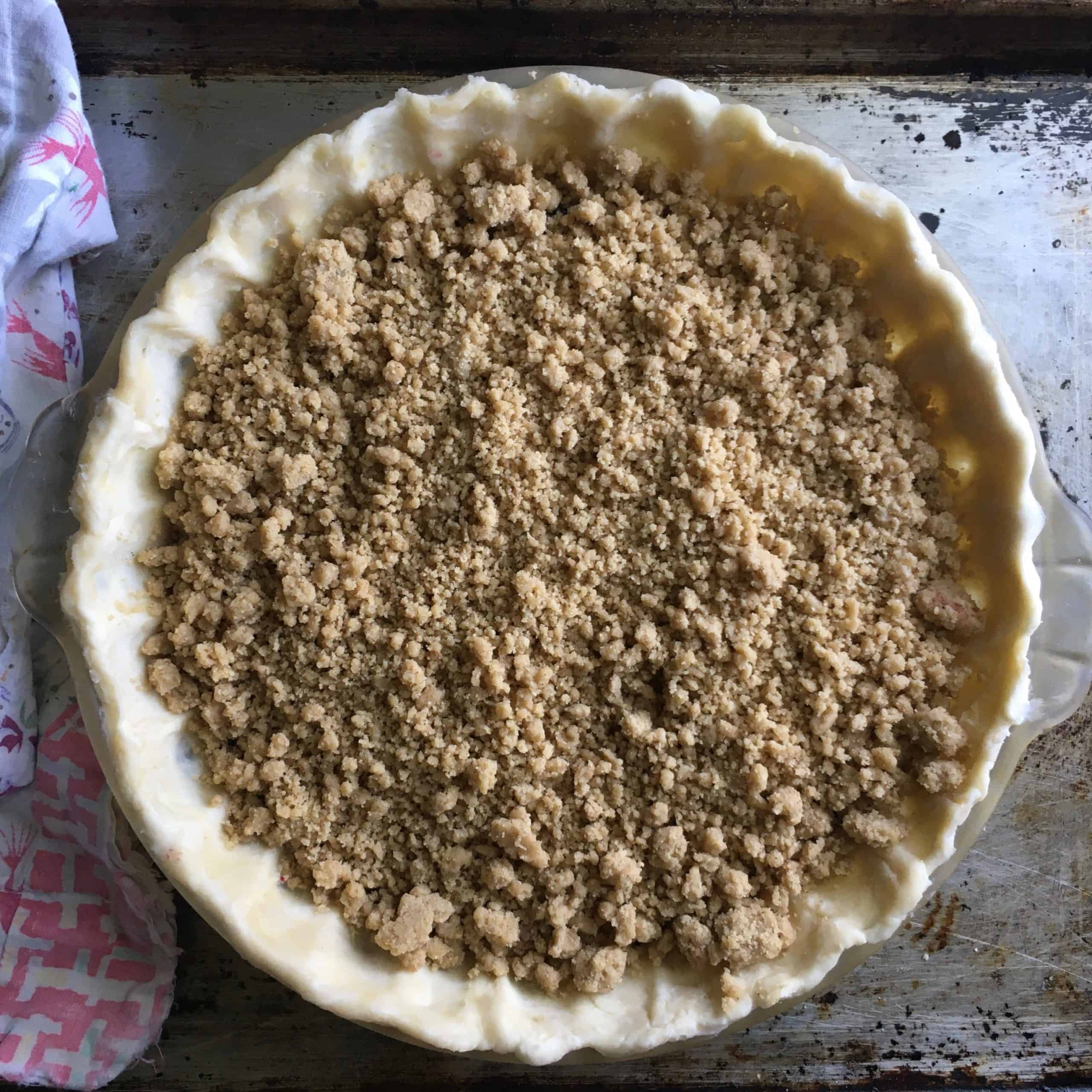 unbaked whole cherry crumb crunch pie with streusel added