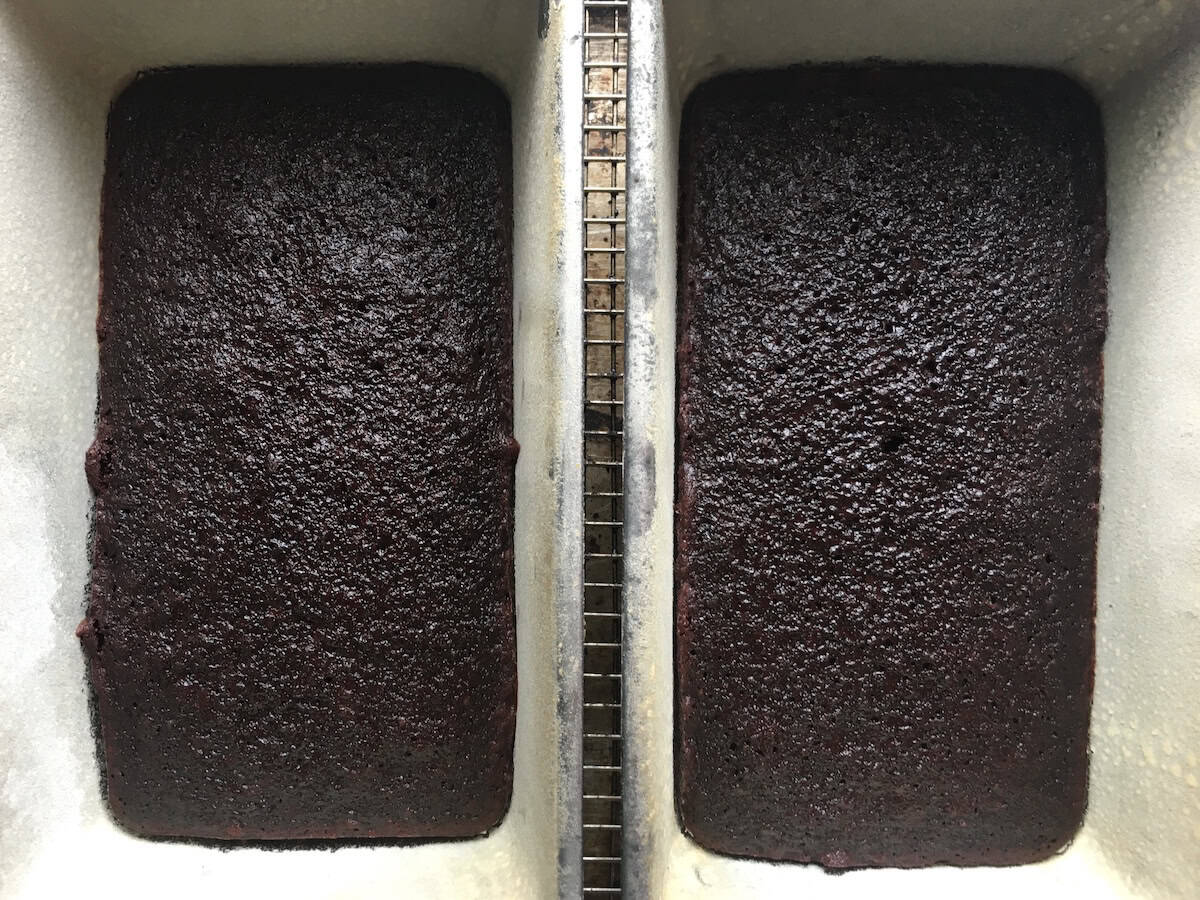 Baked devil's food cake in bread pans for making devil's food cake ice cream sandwiches, showing the moist dark crumb of this versatile devil food cake recipe you can bake in any pan.
