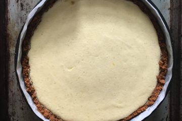 key lime pie in springform pan on a sheet pan