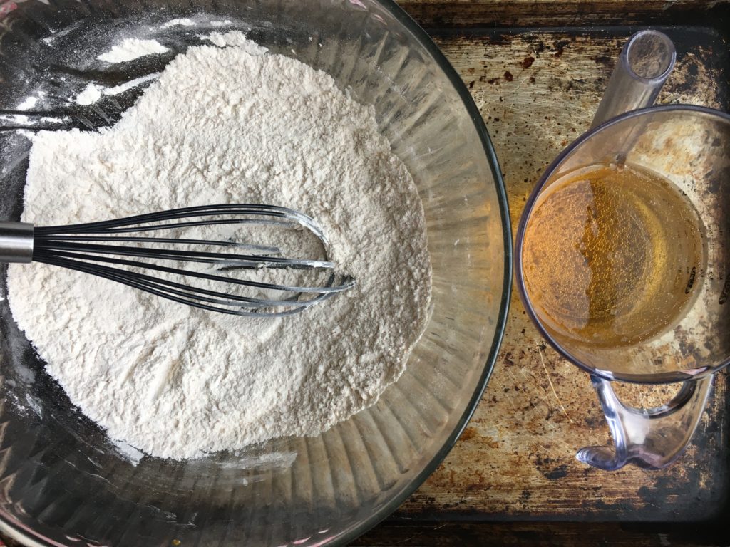 Beer batter ingredients on a half sheet pan.