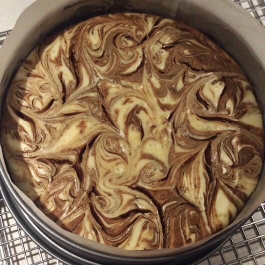 Double Biscoff swirled cheesecake in a springform pan