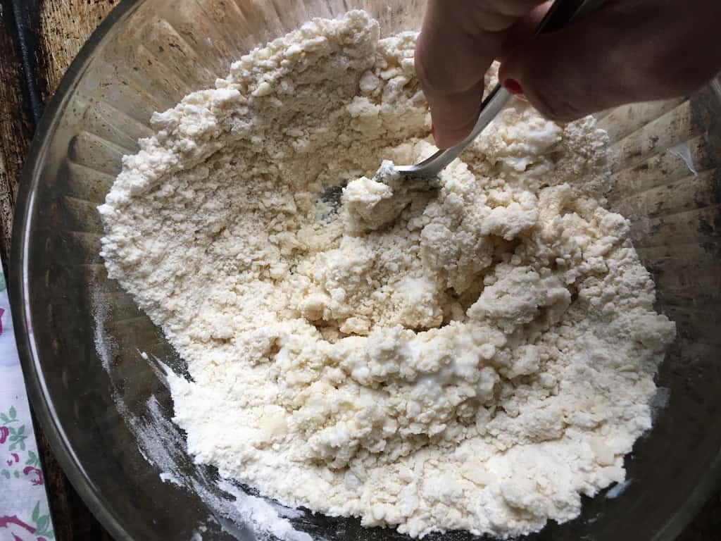blending the buttermilk to the flower mixture with a fork