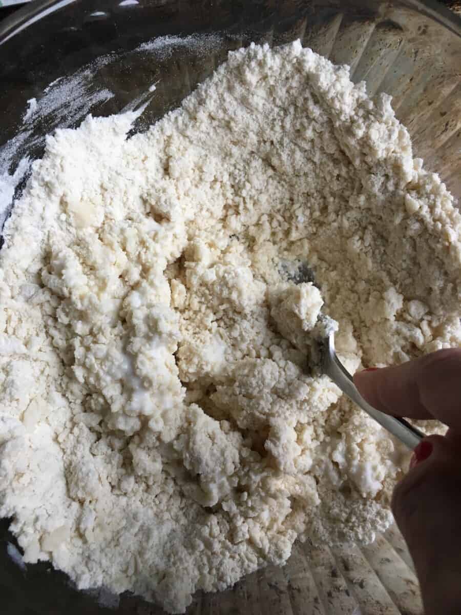 blending the buttermilk to the flower mixture with a fork