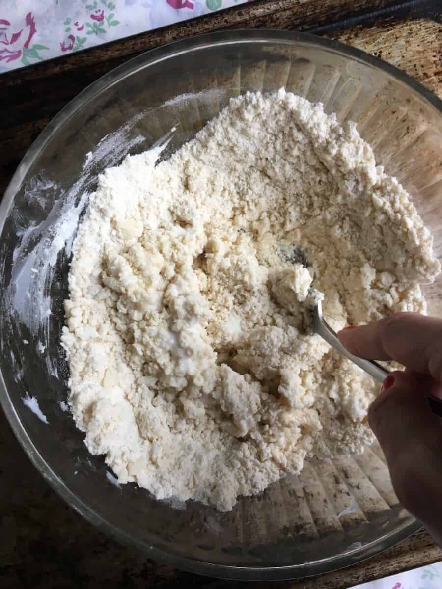 blending the buttermilk to the flower mixture with a fork