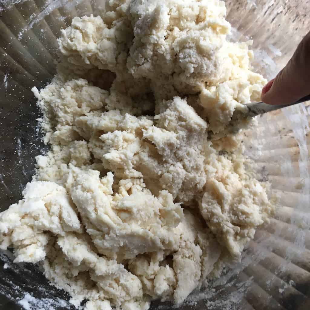 blending the buttermilk to the flower mixture with a fork