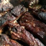 glazed and broiled pork ribs with a little "bark" lookind darker and richer in color