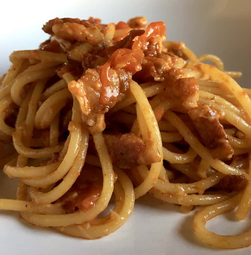 a plate full of spaghetti all' amatriciana