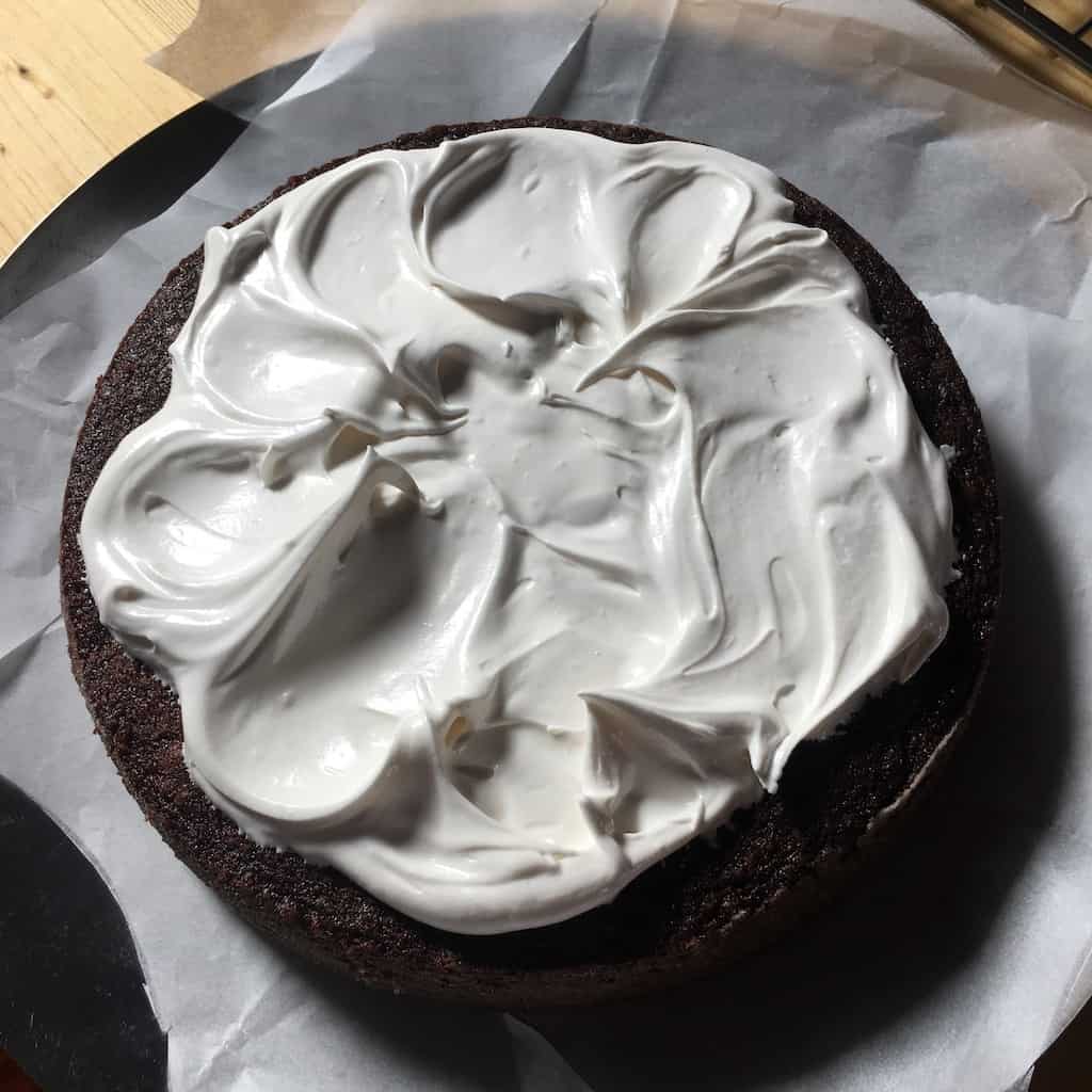 7-minute frosting spread like clouds on devil's food cake layer (first layer).