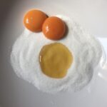 sugar and honey and 2 bright orange egg yolks and it sort of looks like Cookie Monster