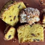 Slices of homemade Easter Colomba bread on a cutting board.