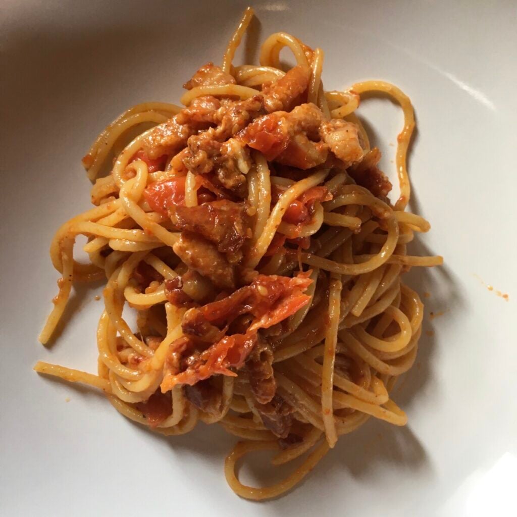One portion of spaghetti all'Amatriciana on a plate