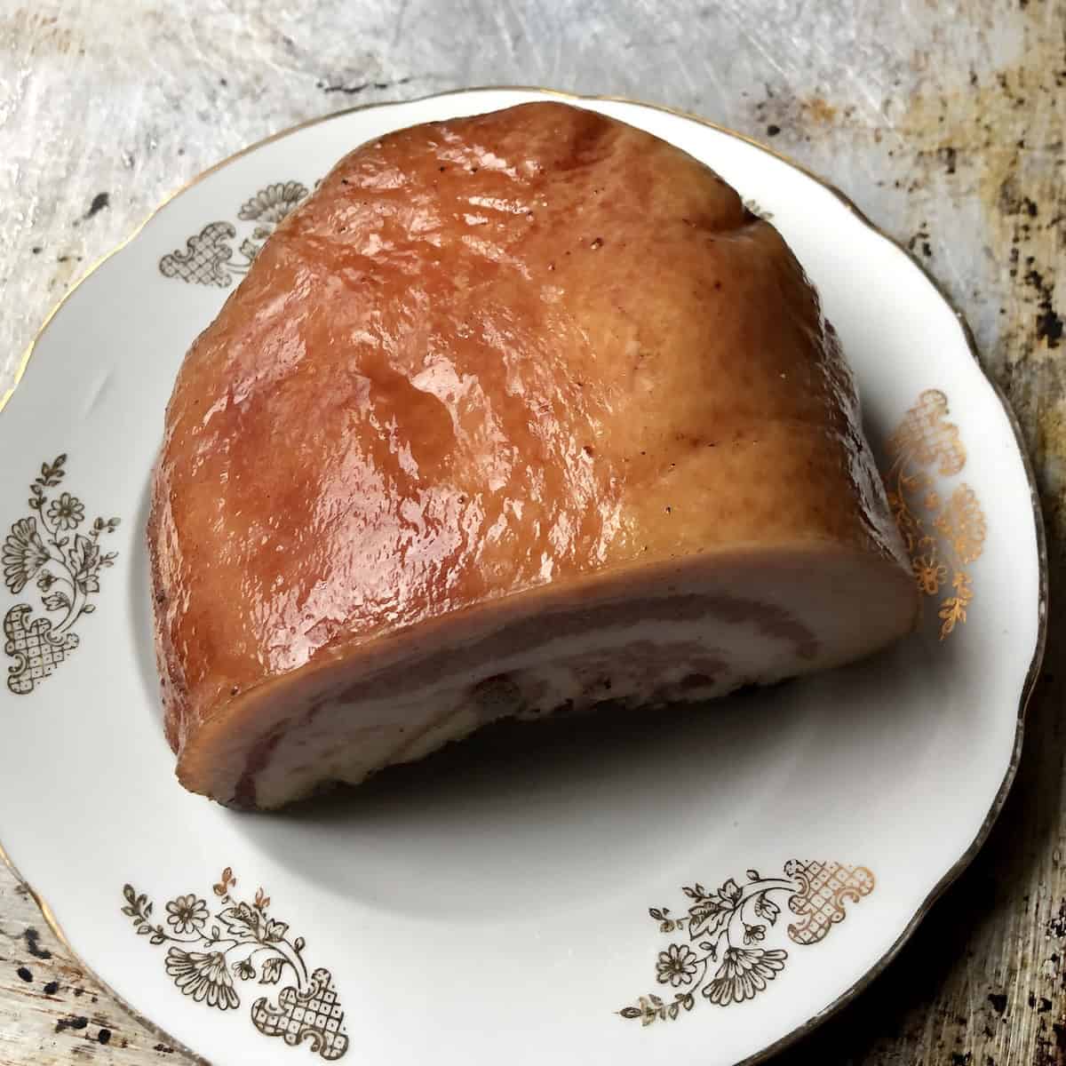 Italian guanciale cured pork jowl slab showing skin side, authentic ingredient for amatriciana, gricia, and carbonara pasta from one of our Abruzzo Italy butchers.
