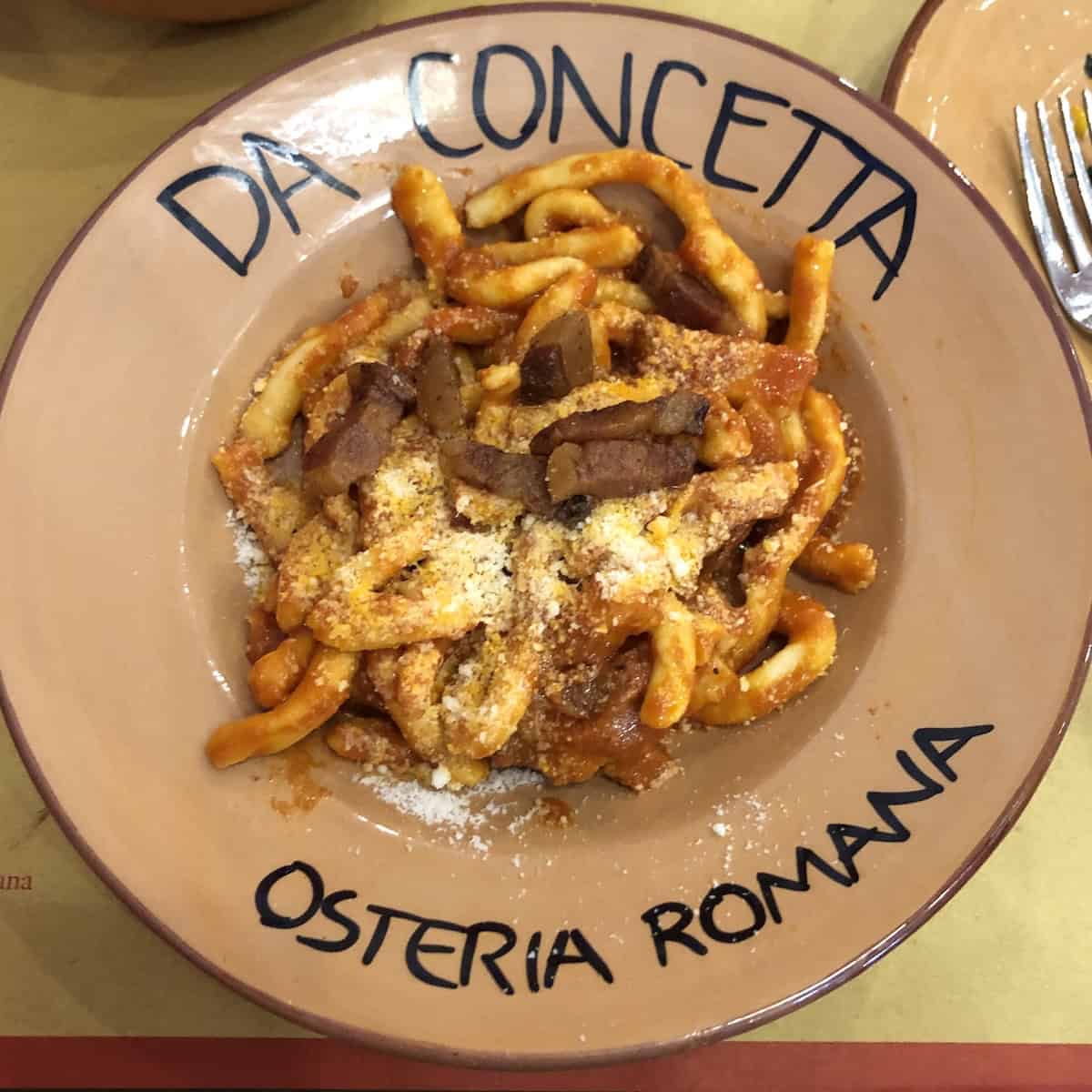 Strozzapreti all'amatriciana from Da Concetta osteria Romana in Pescara Italy, authentic roman pasta with guanciale and amatriciana sauce.
