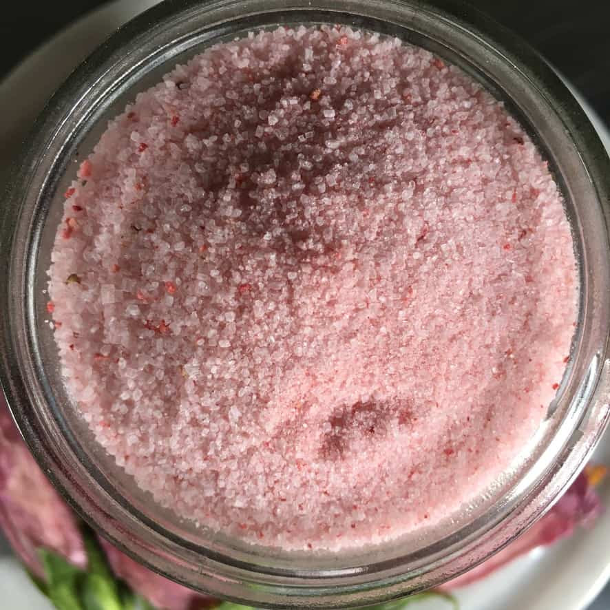a jar of pink strawberry sugar