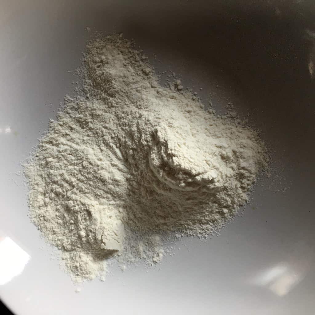 all-purpose flour added to a shallow bowl