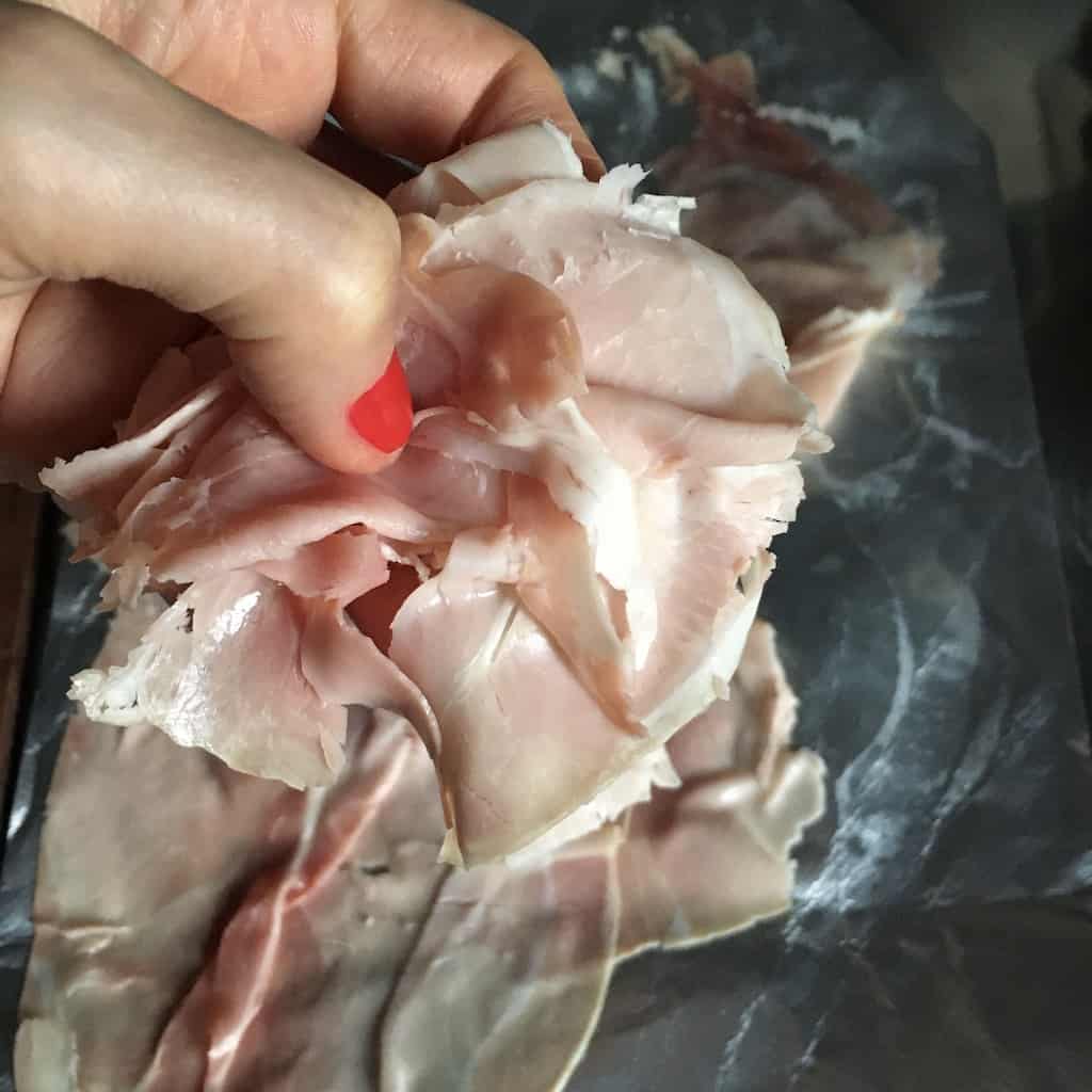 my hand holding prosciutto cotto (ham)