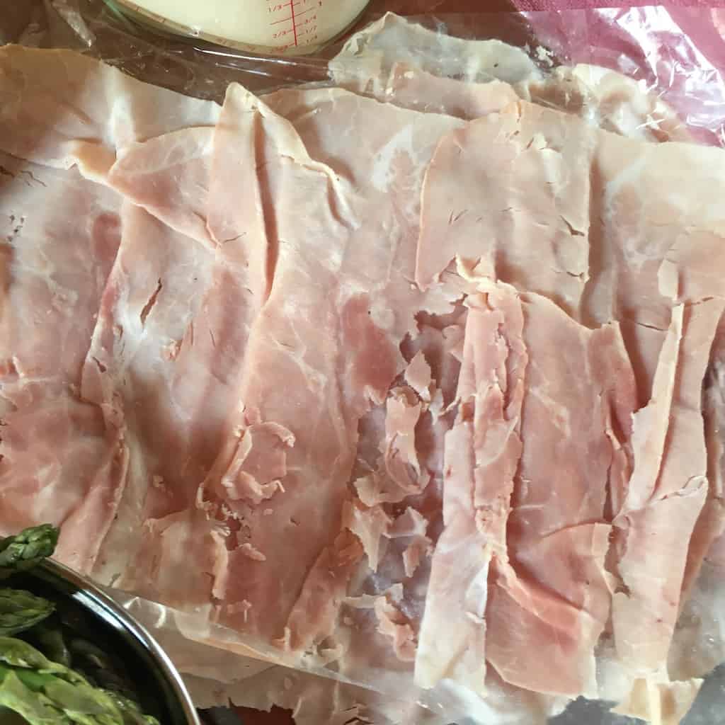 prociutto cotto closeup on cutting board