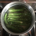 asparagus blanching in a pot of water
