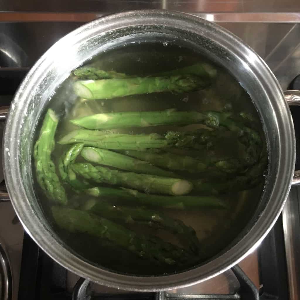 asparagus blanching in a pot of water