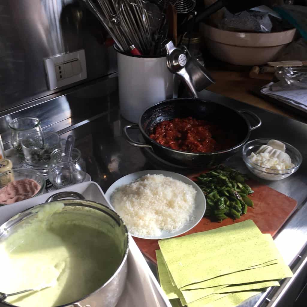lasagna ingredients ready to assemble the lasagna on a cutting board on the counter top