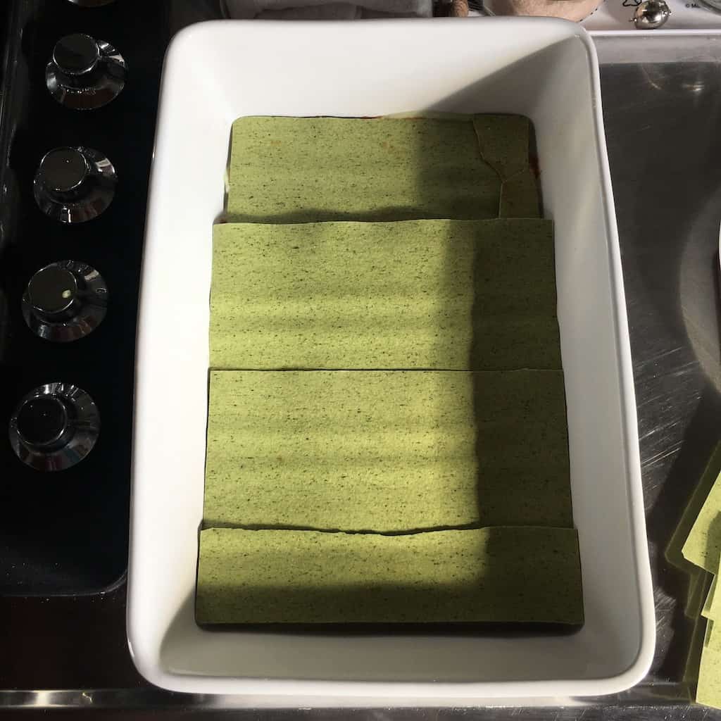 green lasagna noodles layered over the top