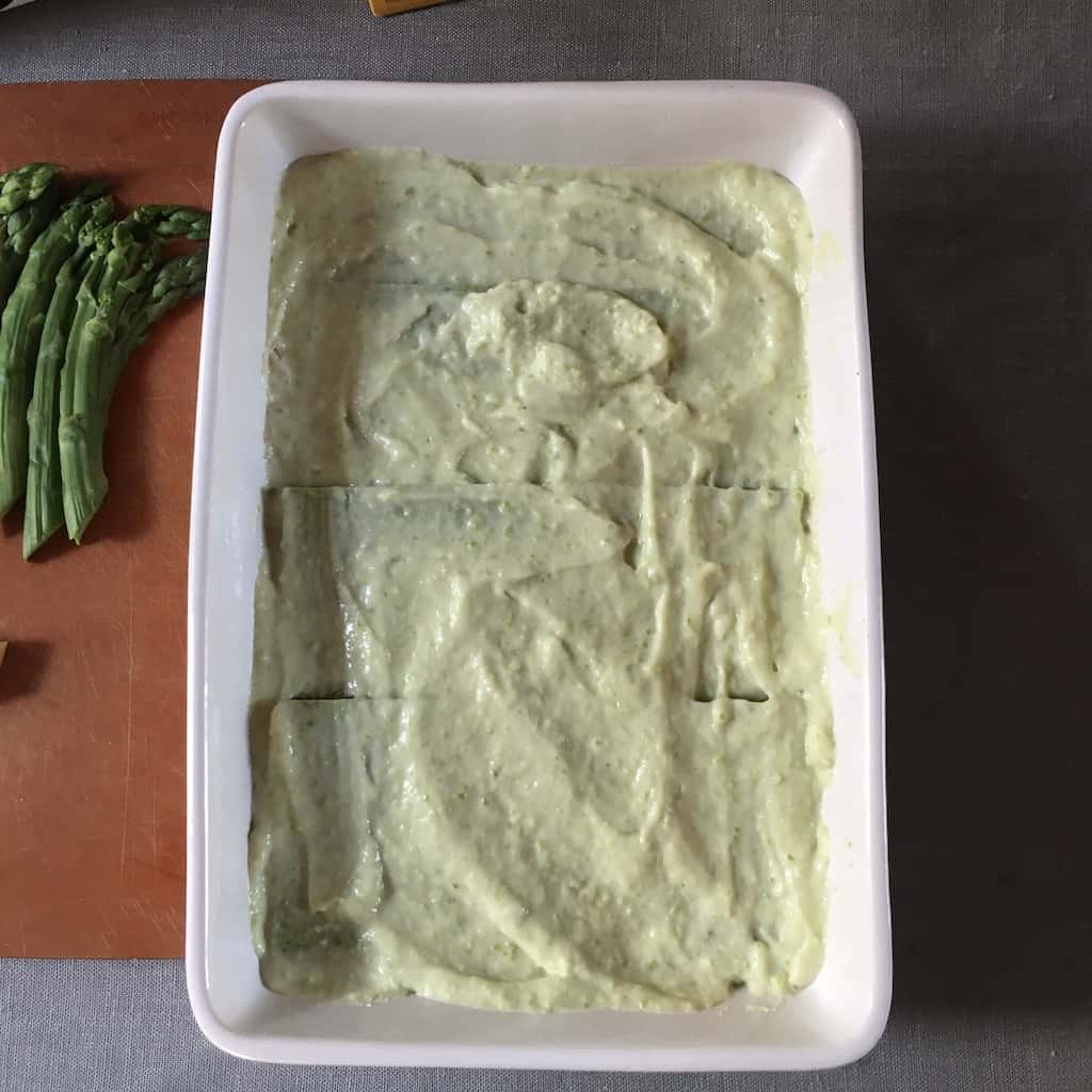 bechamel evenly spread out over the lasagna noodles