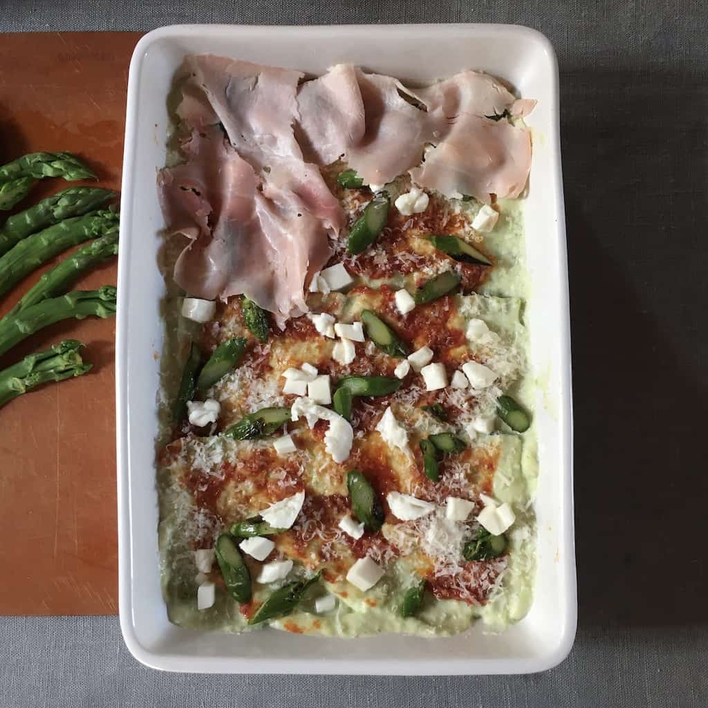 prosciutto cotto layered over only half the lasagna so far