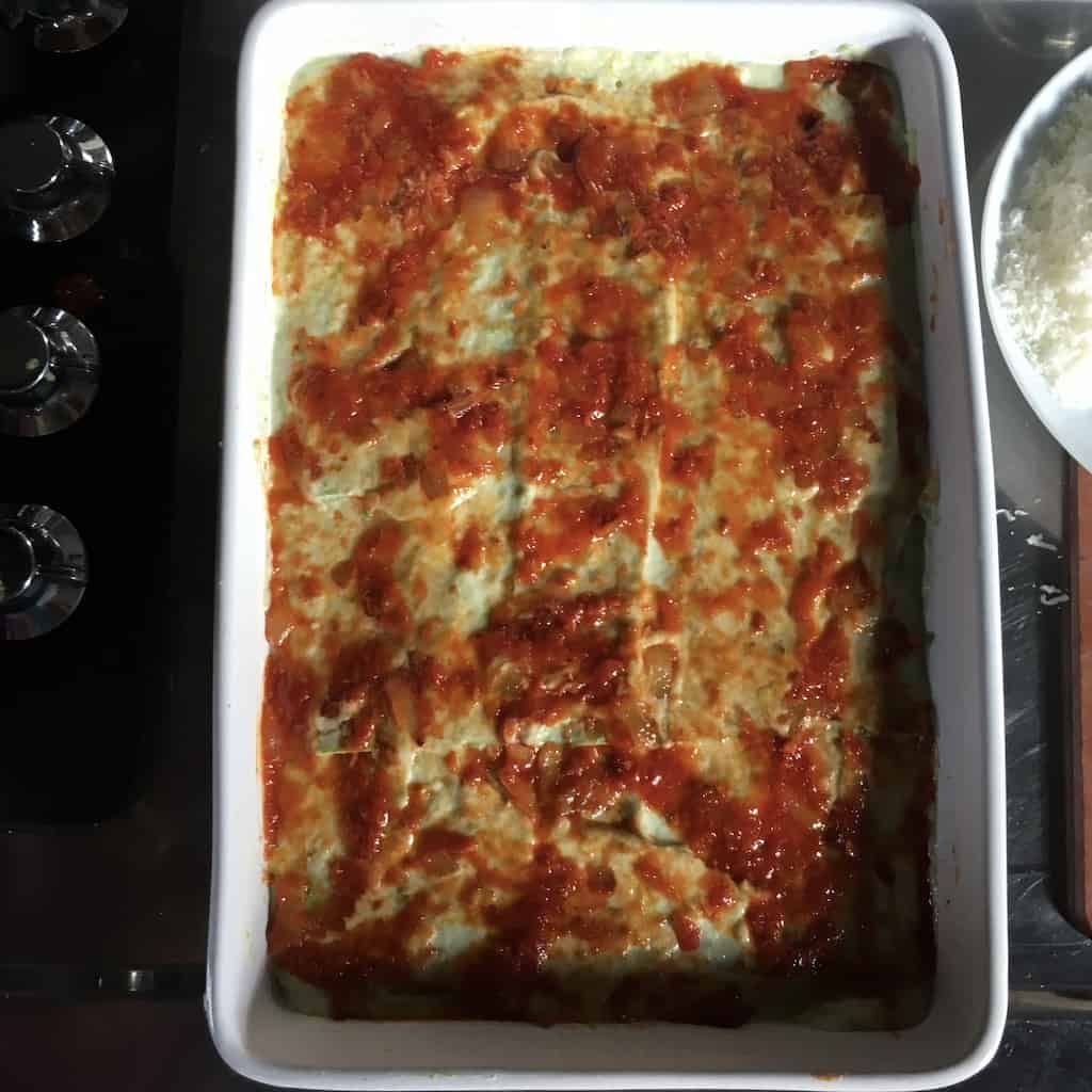 prosciutto sugo layer spread evenly over the bechamel