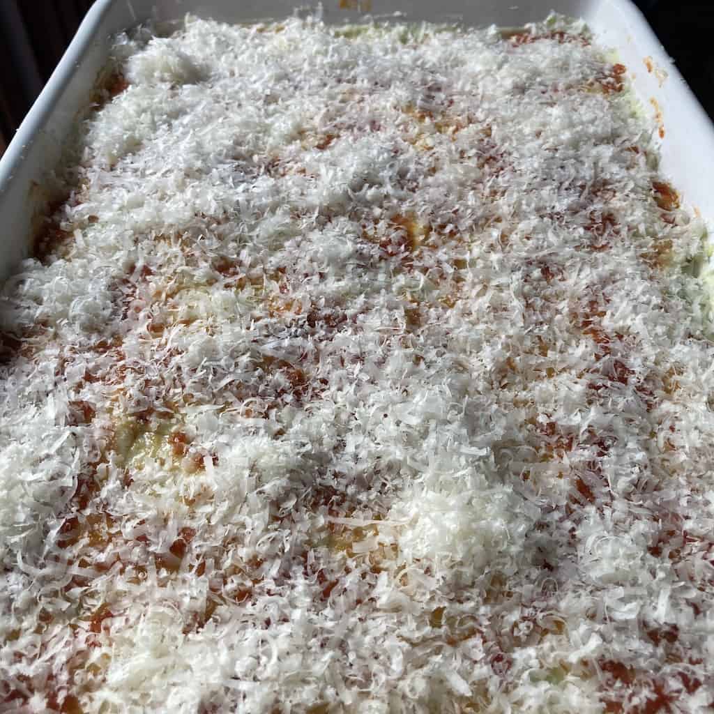 a more plentiful generous sprinkling of grated cheese over the top