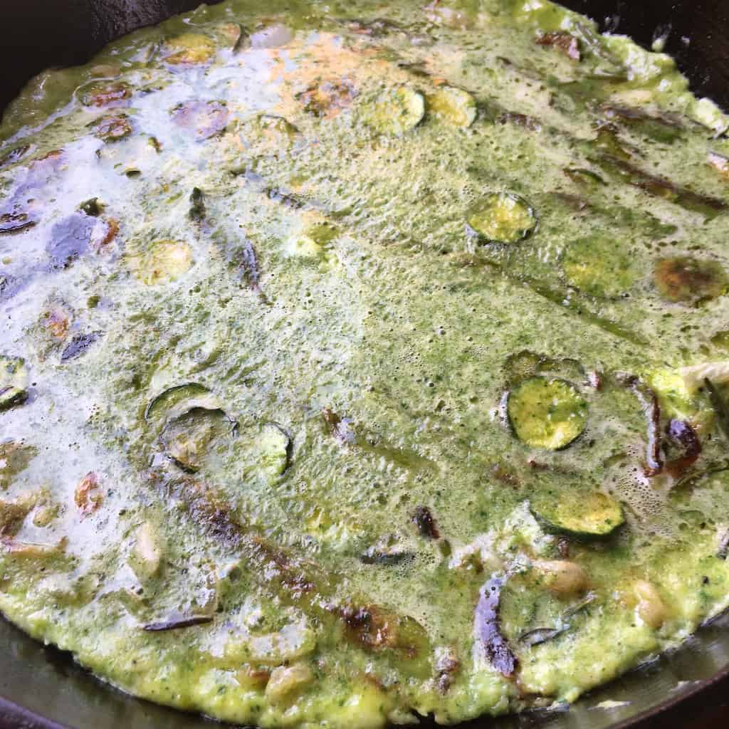 frittata view as it cooks and the edges of the mixture start to form and firm up