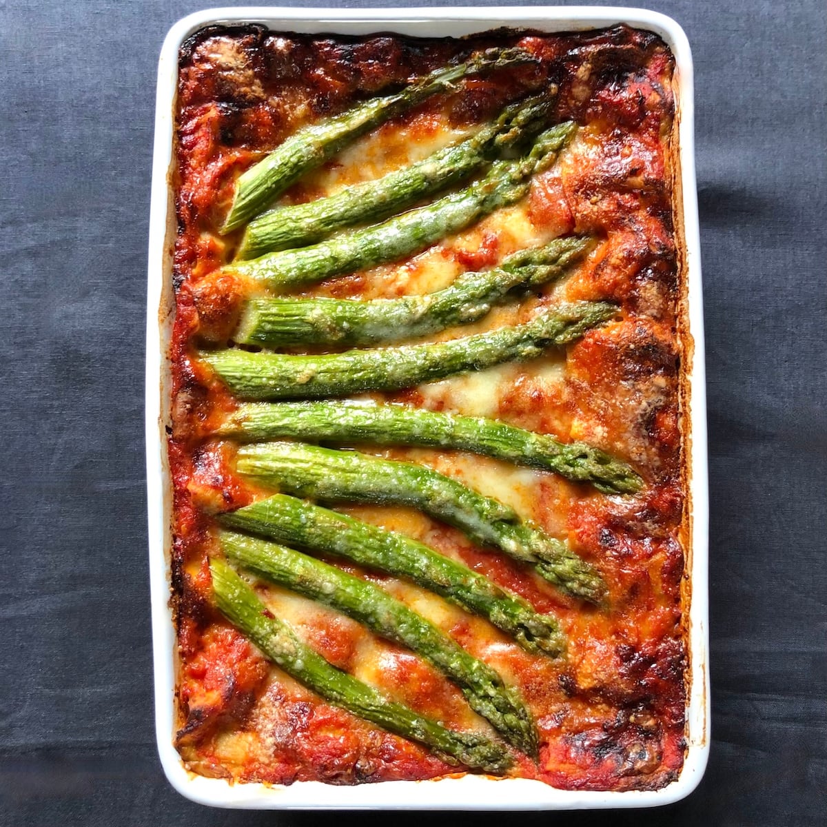 Crispy prosciutto and pan seared asparagus lasagna with asparagus bechamel and zucchini crema.
