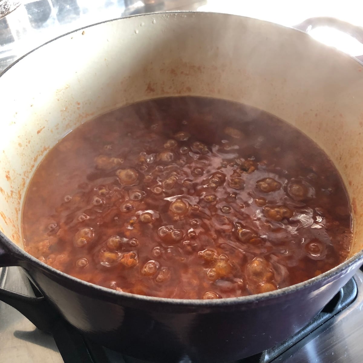 Cooking Bolognese sauce for 20 minutes after adding the red wine to cook off the alcohol.