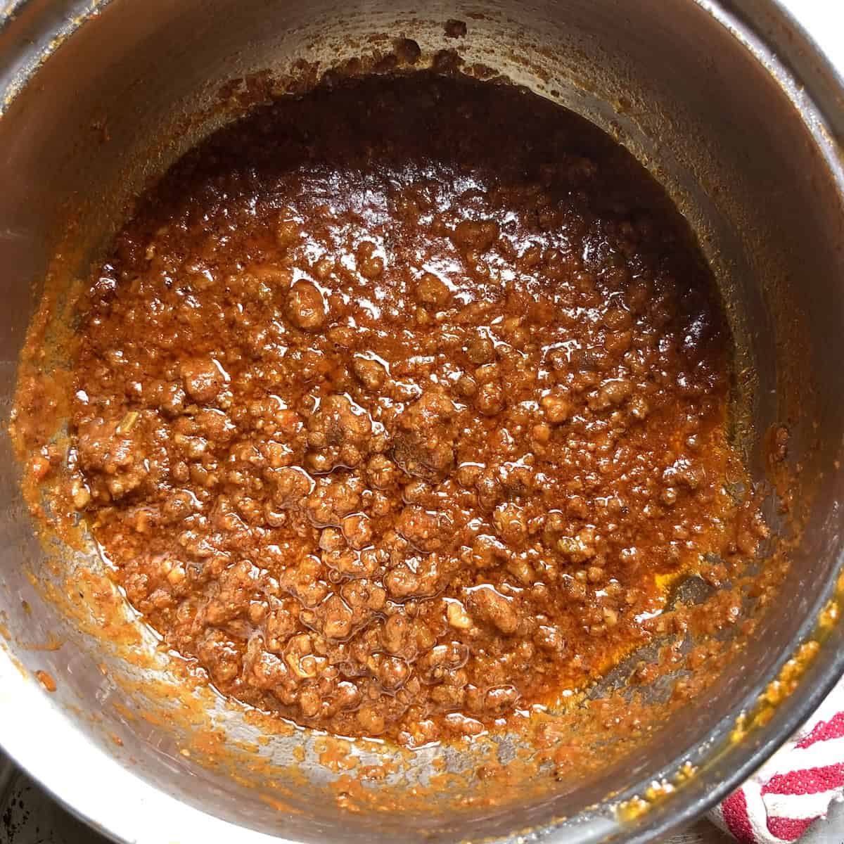 A pot of finished homemade ragu bolognese ready to serve, best bolognese sauce recipe for an authentic Italian ragu recipe made from scratch.