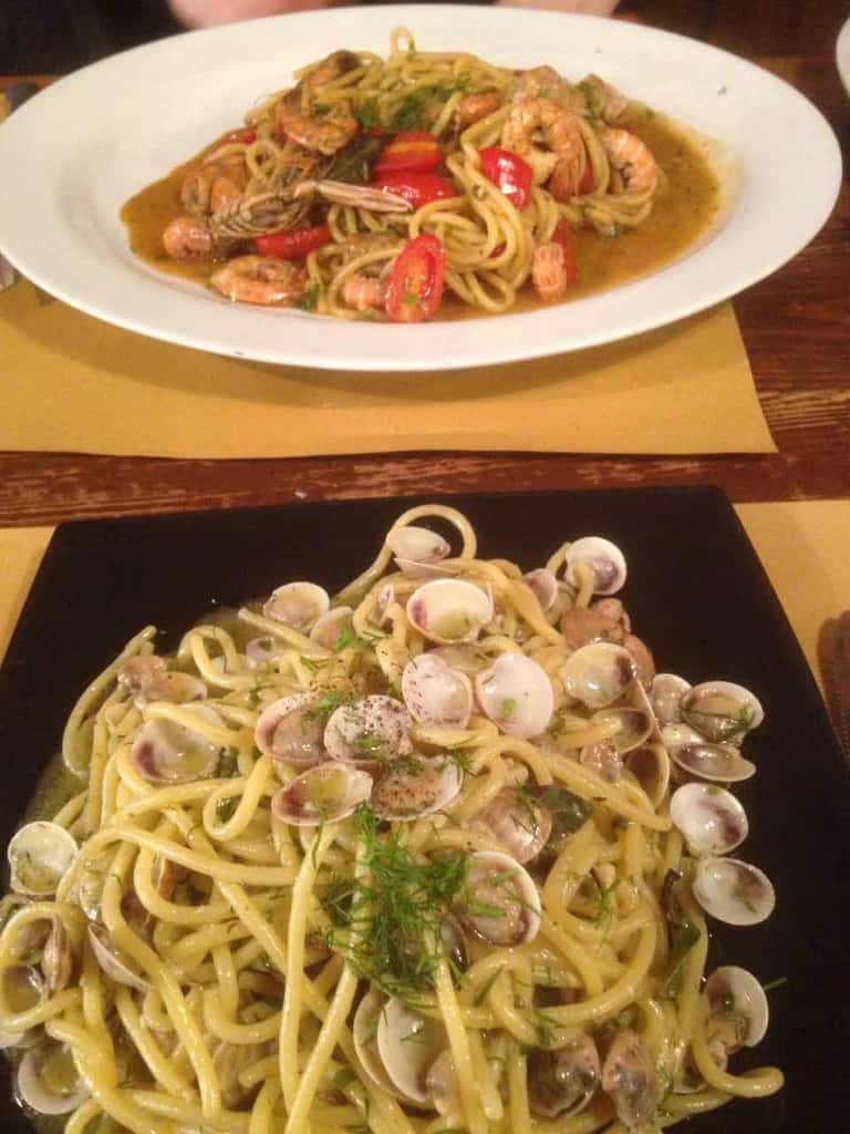 plate full of spaghetti with clams from Italian restaurant in Italy