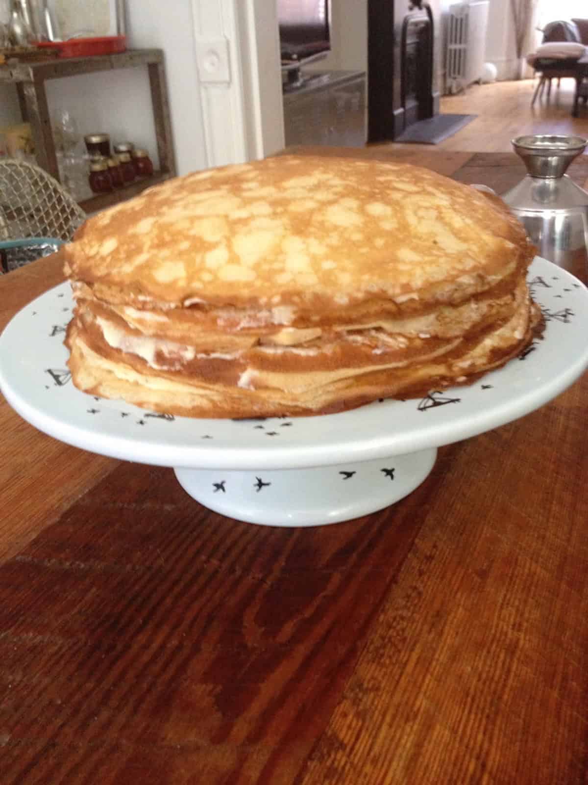 Homemade mille crepe cake inspired by crepe cake Lady M, showing layered crepes and pastry cream in this crepe cake recipe and crepe cake filling idea.

