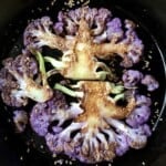 Purple cauliflower steaks perfectly crispy and tender with a crispy sesame seed crust.