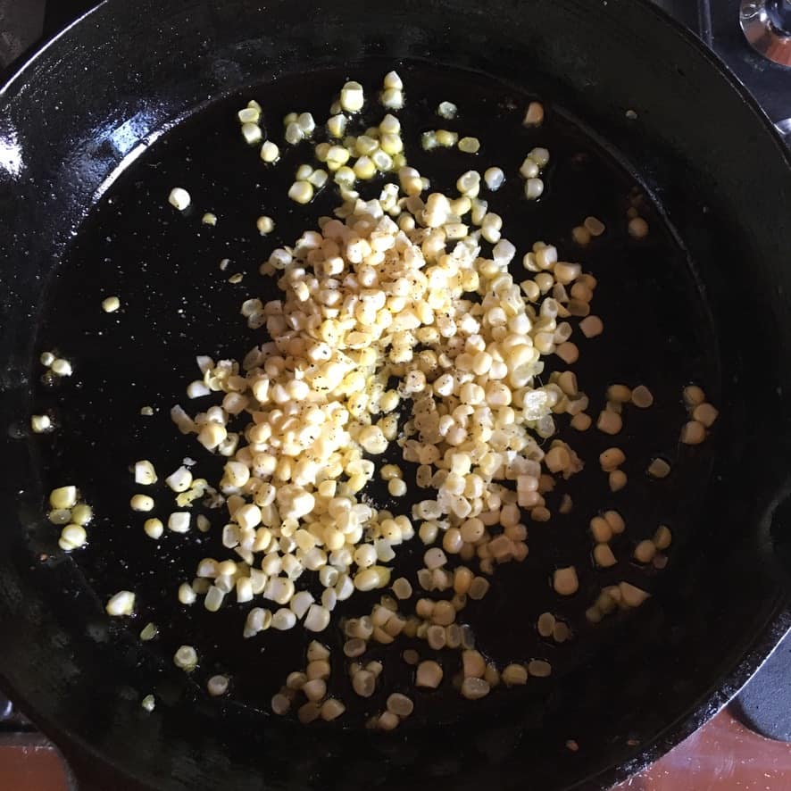 fresh cut corn in a cast iron skillet
