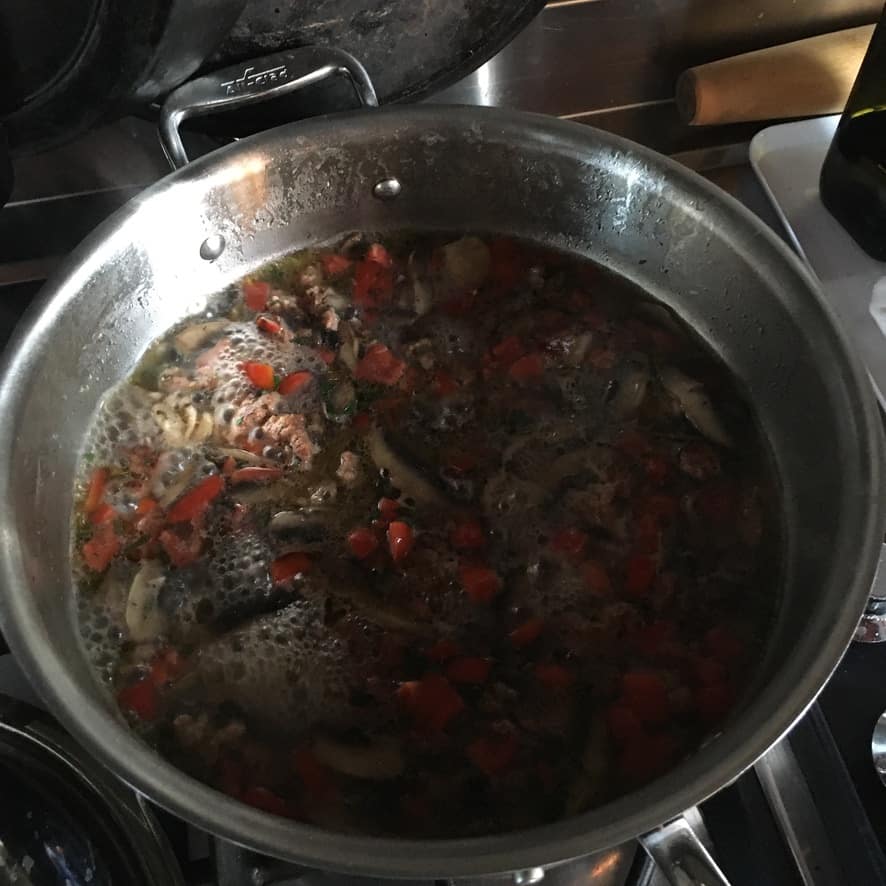 the mussel sauce after the steamed mussels have been removed