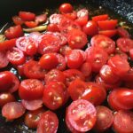 sliced tomatoes in the pan