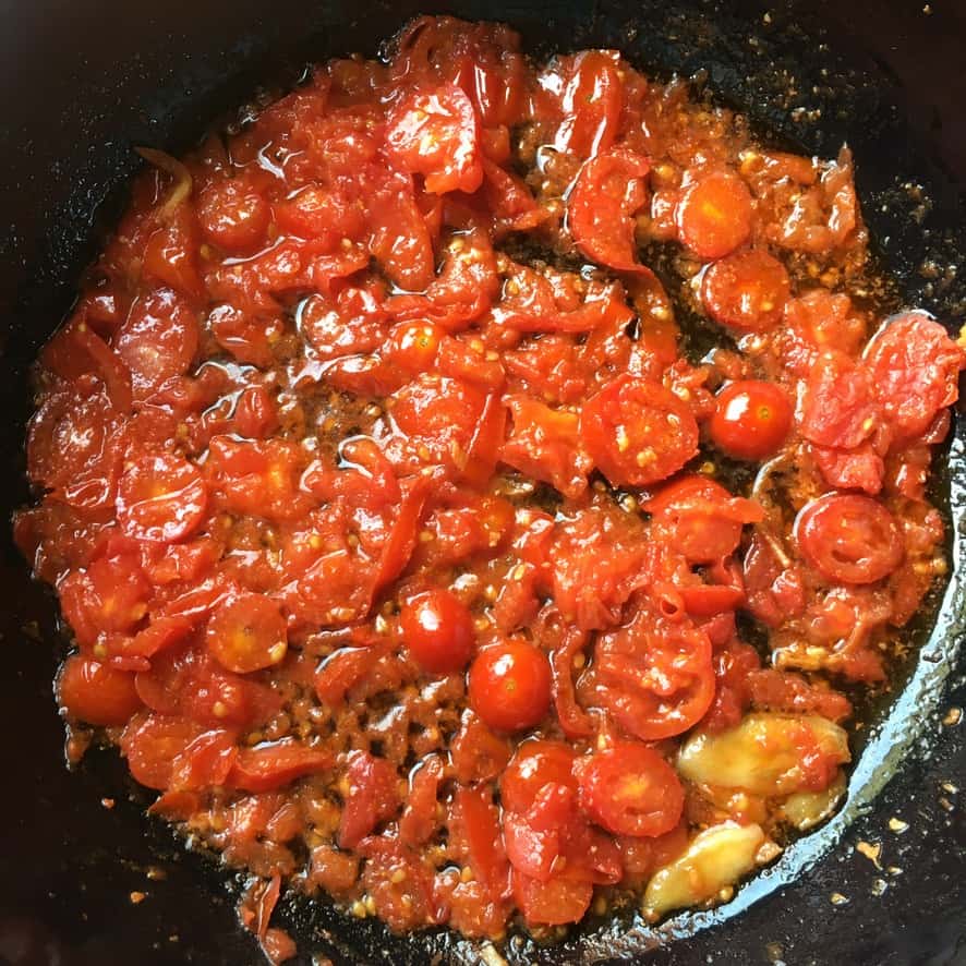 cooked baby grape tomatoes which have softened