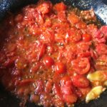 cooked baby grape tomatoes which have softened