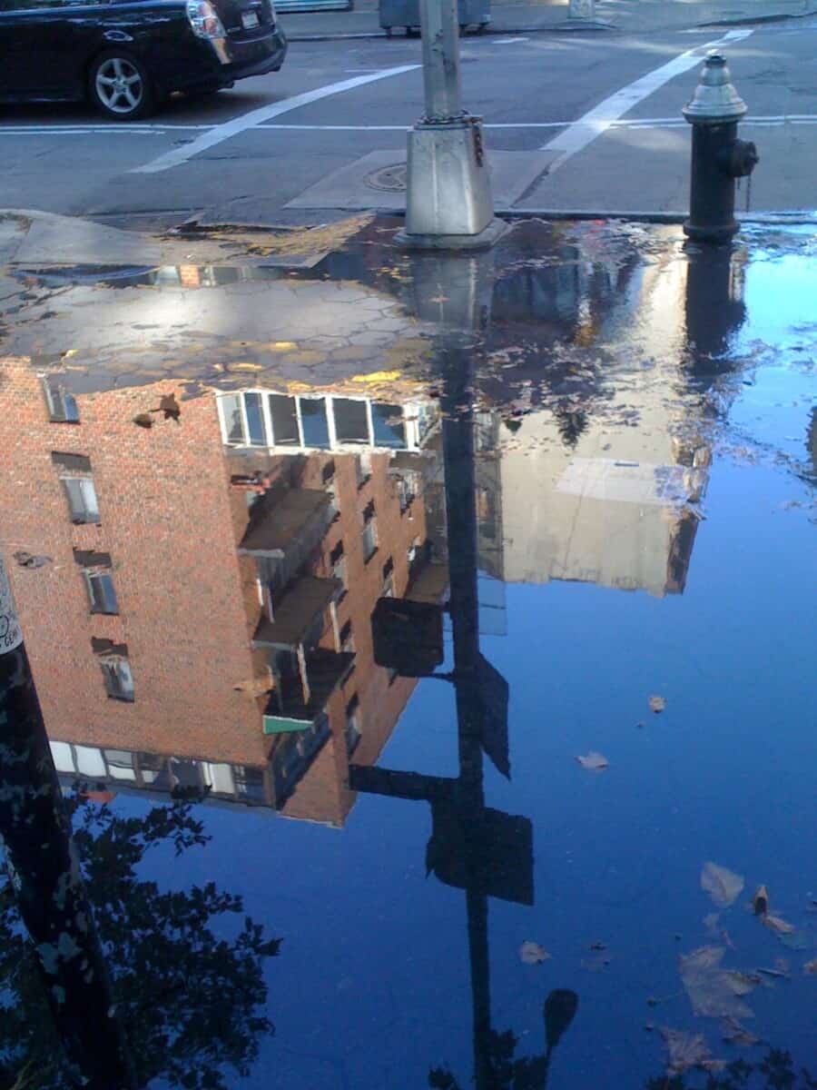 reflections of NYC in puddles left after the rain 3
