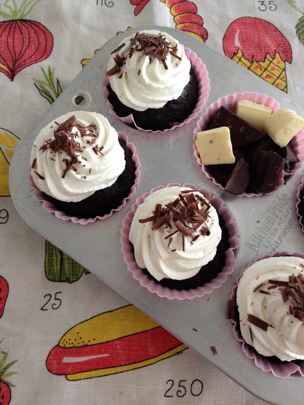 Chocolate cupcakes with light vanilla bean whipped cream frosting that balances the richness of devil's food cake, a less sweet alternative to devil's food with buttercream frosting.
