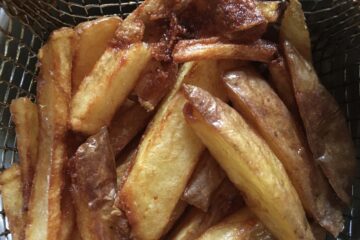 the crispiest, golden french fries in the fryer basket