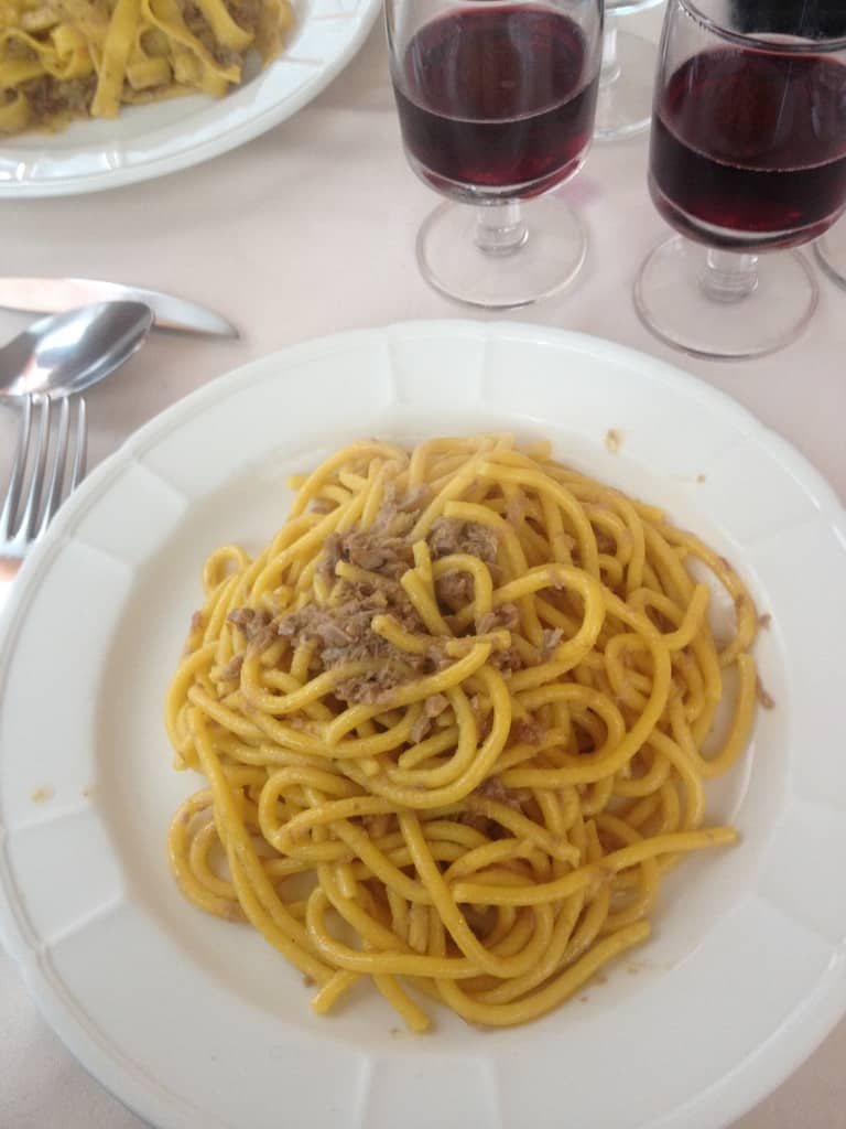 a plate full of bigoli pasta from a local restaurant