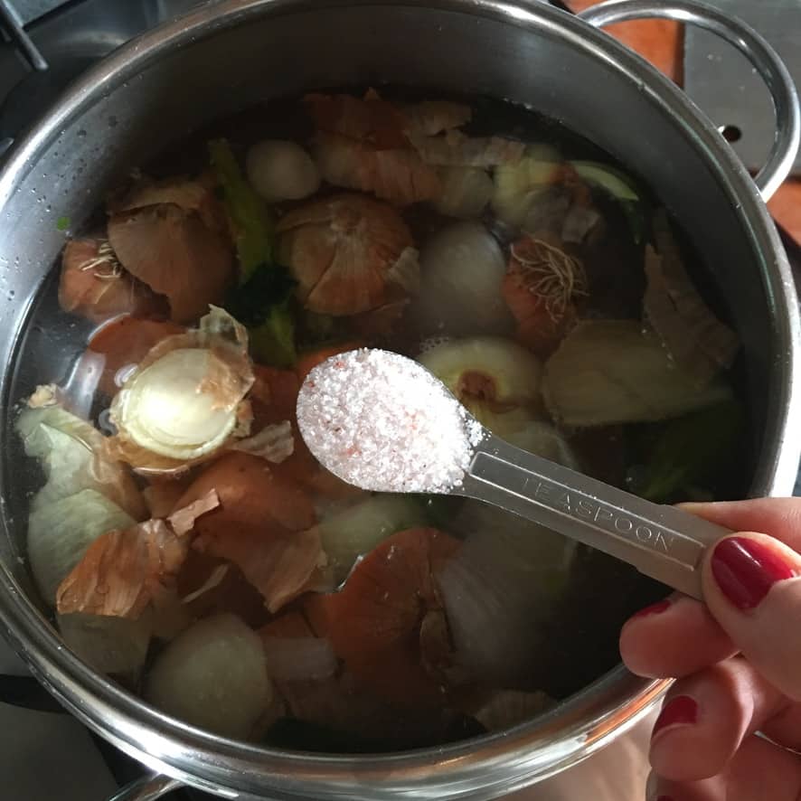 Adding a teaspoon of salt to the duck stock