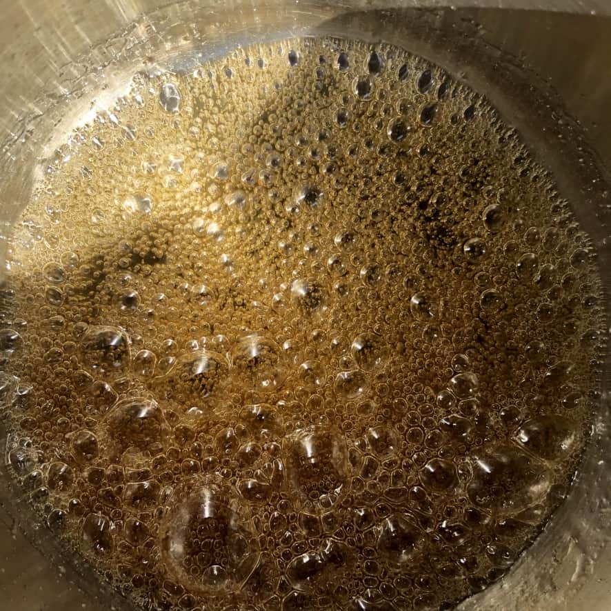 Deep amber caramel ready for the heavy cream.
