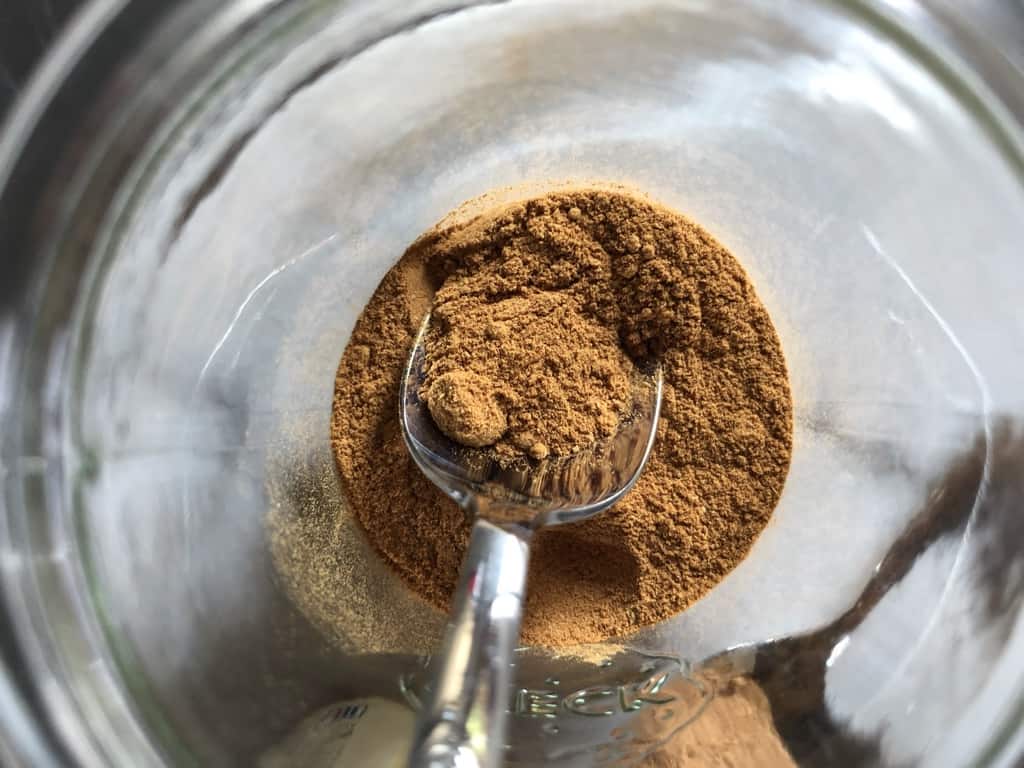 A top down view into a glass Weck jar filled with homemade pumpkin pie spice substitute.
