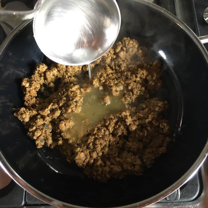 adding the starchy water to the duck ragû